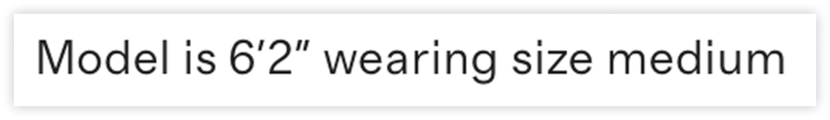 Closeup of text saying the model is 6 foot 2 inches tall and wearing a size medium